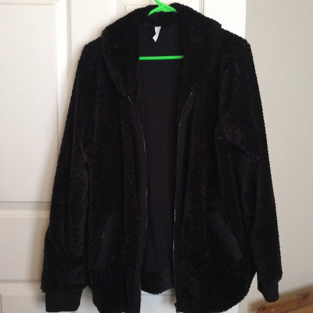 Woman’s zip up jacket.